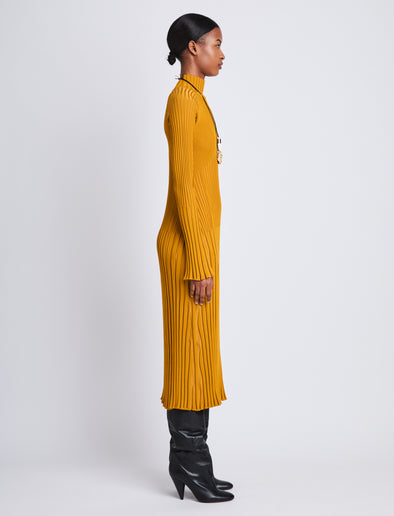 Side image of model wearing Carmen Dress In Midweight Viscose Rib in gold