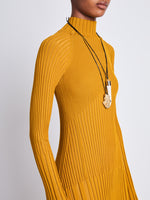 Detail image of model wearing Carmen Dress In Midweight Viscose Rib in gold