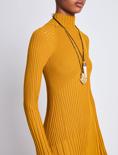 Detail image of model wearing Carmen Dress In Midweight Viscose Rib in gold
