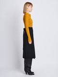 Side image of model wearing Carla Sweater In Midweight Viscose Rib in gold