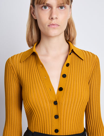 Detail image of model wearing Carla Sweater In Midweight Viscose Rib in gold