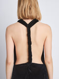 Detail image of model wearing Faye Backless Twist Back Dress In Velvet in black