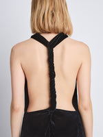 Detail image of model wearing Faye Backless Twist Back Dress In Velvet in black