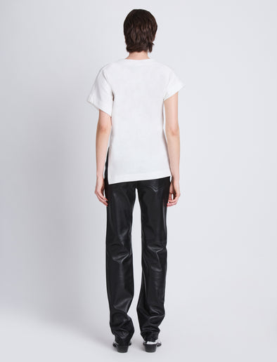 Back full length image of model wearing Hopper T-Shirt in WHITE