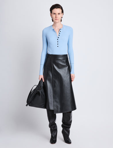 Front full length image of model wearing Agnes Henley Sweater in LIGHT BLUE