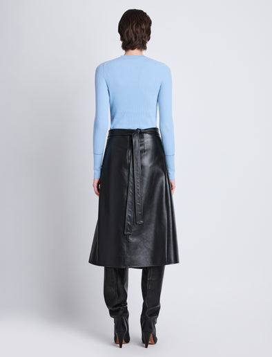 Back full length image of model wearing Agnes Henley Sweater in LIGHT BLUE