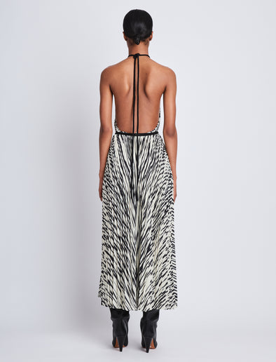 Back full length image of model wearing Frida Halter Dress In Printed Sheer Pleated Chiffo in ECRU MULTI