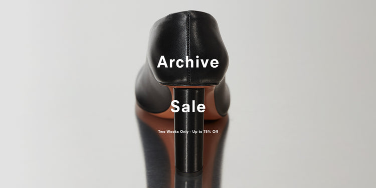 Back image of black heel on silver background, 'Archive Sale, Two Weeks Only - Up to 75% Off' overlaid