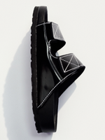 Aerial side image of Birkenstock x Proenza Schouler Arizona Slides in black on white backdrop