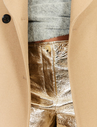 Cropped image of model in Metallic Leather Pant in pale gold