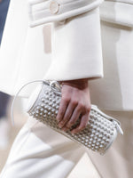 Image of model walking Proenza Schouler Fall Winter 2024 Runway wearing Silo Bag in Knotted Smooth Nappa in optic white
