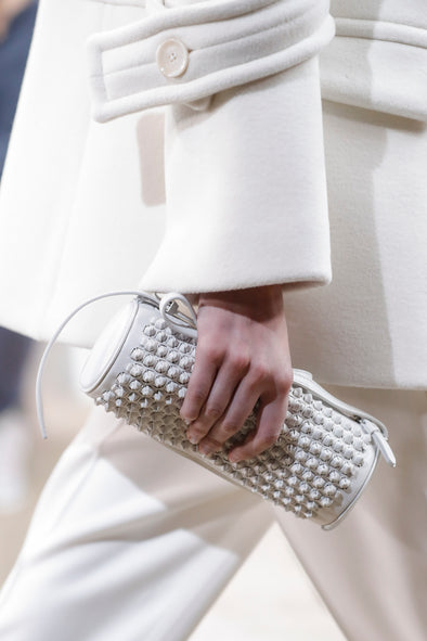 Image of model walking Proenza Schouler Fall Winter 2024 Runway wearing Silo Bag in Knotted Smooth Nappa in optic white