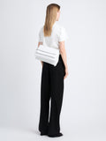 Image of model carrying City Bag in Optic White from the back