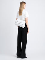 Image of model carrying City Bag in Optic White from the back