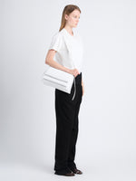 Image of model carrying City Bag in Optic White