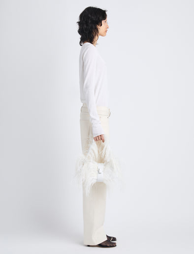 Image of model holding Park Shoulder Bag In Optic White Nylon With Feathers