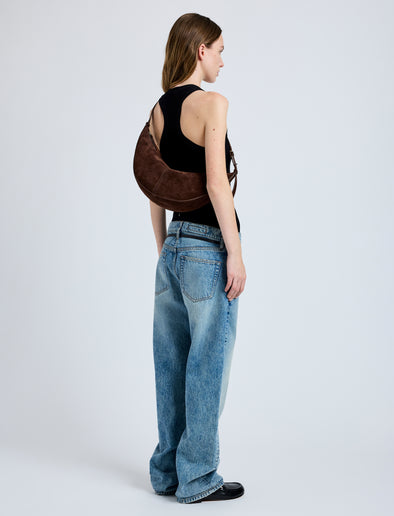 Image of model wearing Slide Bag in Soft Suede in Chocolate
