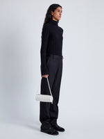 Image of model wearing Silo Bag in Embossed Ostrich Calf in Cream