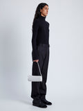 Image of model wearing Silo Bag in Knotted Nappa in Optic White