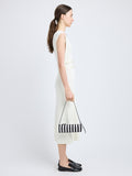 Proenza Schouler image of model carrying Silo Bag in Pieced Stripes in black/white