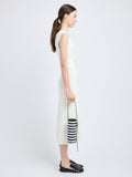 Proenza Schouler image of model carrying Silo Bag in Pieced Stripes in black/white