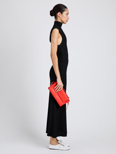 Proenza Schouler Image of model wearing Tate Clutch with Strap in Smooth Calf in Vermillion