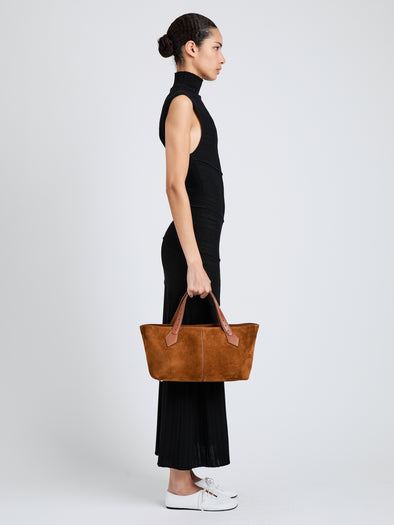 Proenza Schouler Image of model wearing East West Chelsea Tote in Soft Suede in Saddle