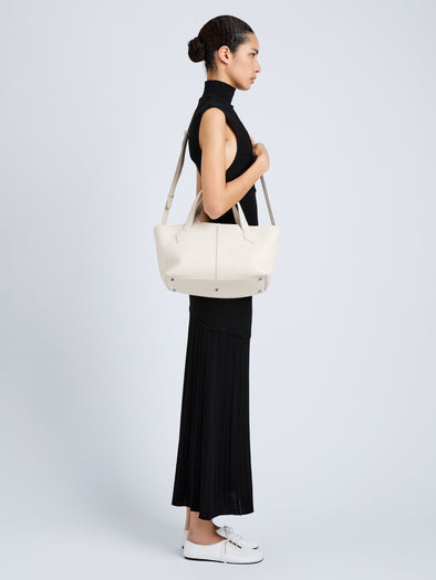 Proenza Schouler Image of model wearing East West Chelsea Tote in Pebbled Calf in Soft White