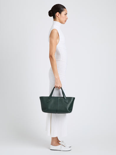 Proenza Schouler Image of model wearing East West Chelsea Tote in Pebbled Calf in Bottle
