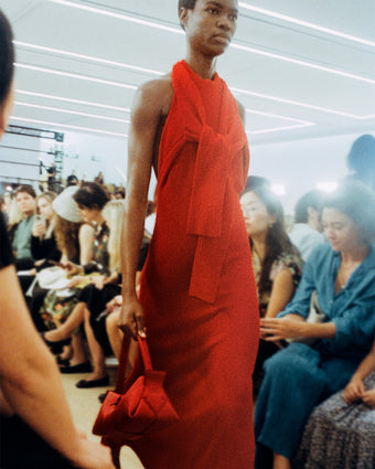 Model walking Proenza Schouler Spring Summer 2024 Runway in Lara Knit Dress in red