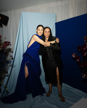 Full length image of Eva Chen with Creative Director Rachel Scott wearing a custom Proenza Schouler gown in Klein Blue