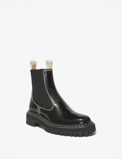 Proenza Schouler front 3/4 image of Lug Sole Chelsea Boots in black