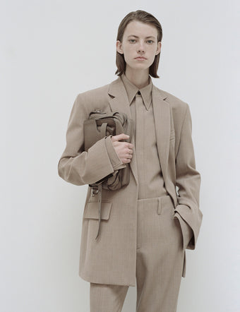 Cropped image of model in Laurie Jacket and Maya Shirt in khaki Wool Melange