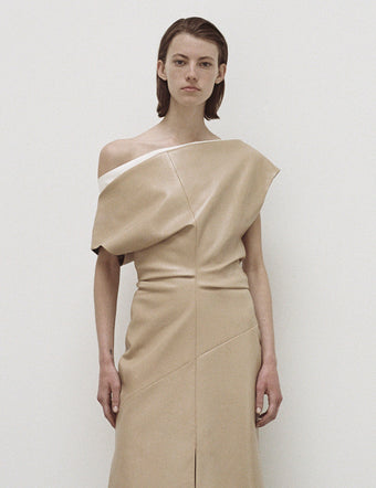 Cropped image of model in Rosa Dress in light khaki