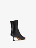 Back 3/4 image of Tee Ankle Boots in black