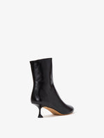 Back 3/4 image of Tee Ankle Boots in black