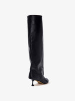 Back 3/4 image of Tee Knee High Boots in black