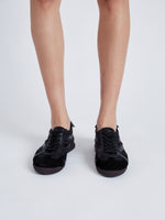Image of model wearing Track Sneakers in black