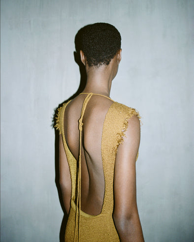 Cropped image of a model wearing Silvia Backless Dress In Silk Doubleface Boucle in cider.