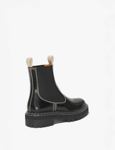 Proenza Schouler back 3/4 image of Lug Sole Chelsea Boots in black