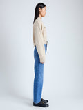 Side image of model wearing Eco Cashmere Cardigan in OATMEAL