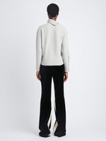 Back image of model wearing Camilla Sweater In Lofty Eco Cashmere in light grey melange