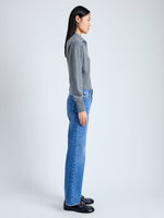 Side image of model wearing Jeanne Polo Sweater in Eco Cashmere in grey melange