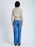 Back image of model wearing Jeanne Sweater In Eco Cashmere in oatmeal