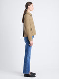 Side full length image of model wearing Lana Jacket In Eco Cotton Twill in DRAB