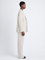 Side full length image of model wearing Devon Jacket In Viscose Wool in CREAM