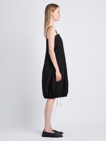 Side full length image of model wearing Emilia Dress In Lightweight Crinkle Poplin in BLACK
