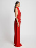 Side image of model wearing Faye Backless Dress In Matte Viscose Crepe in red