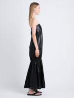 Side image of model in Margot Dress In Glossy Leather in black