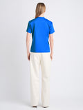 Back image of model wearing Talia V shirt in blue